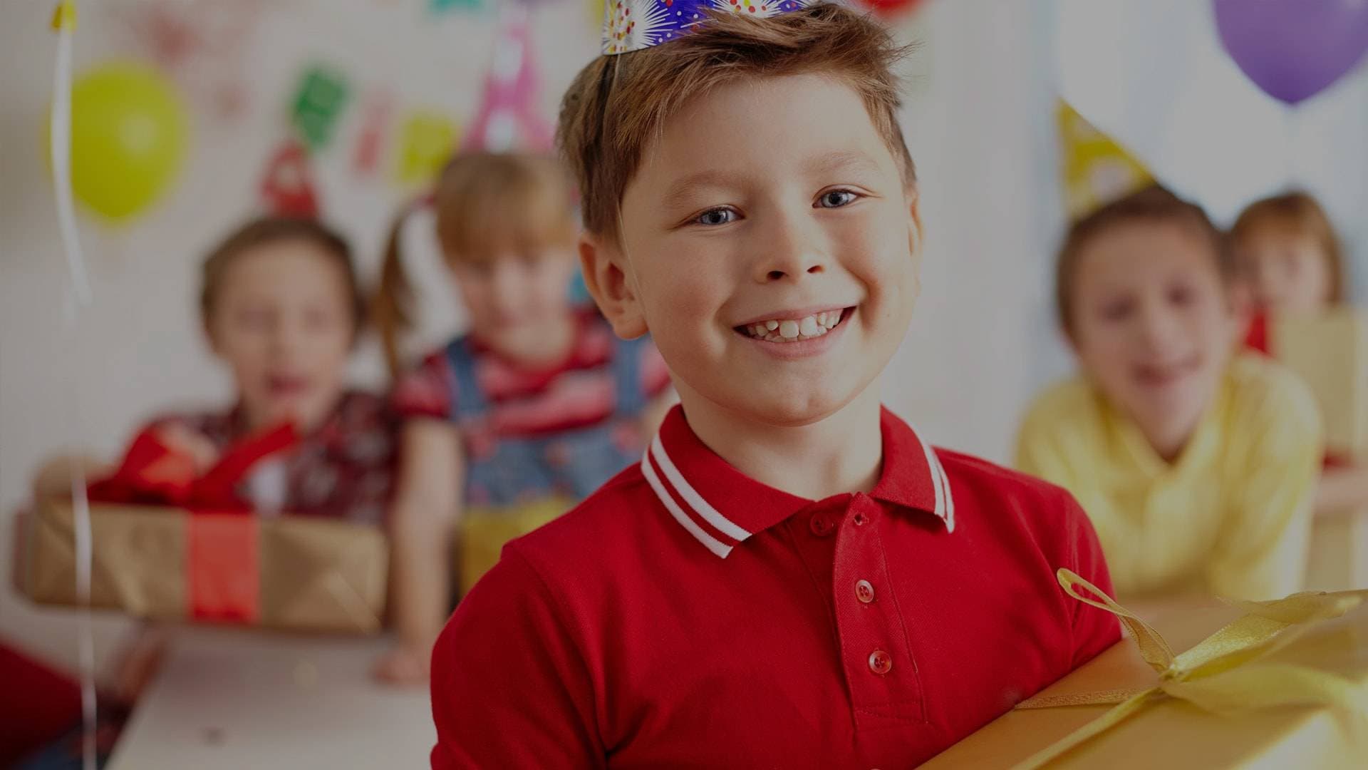 Smiling child in school uniform in classroom environment